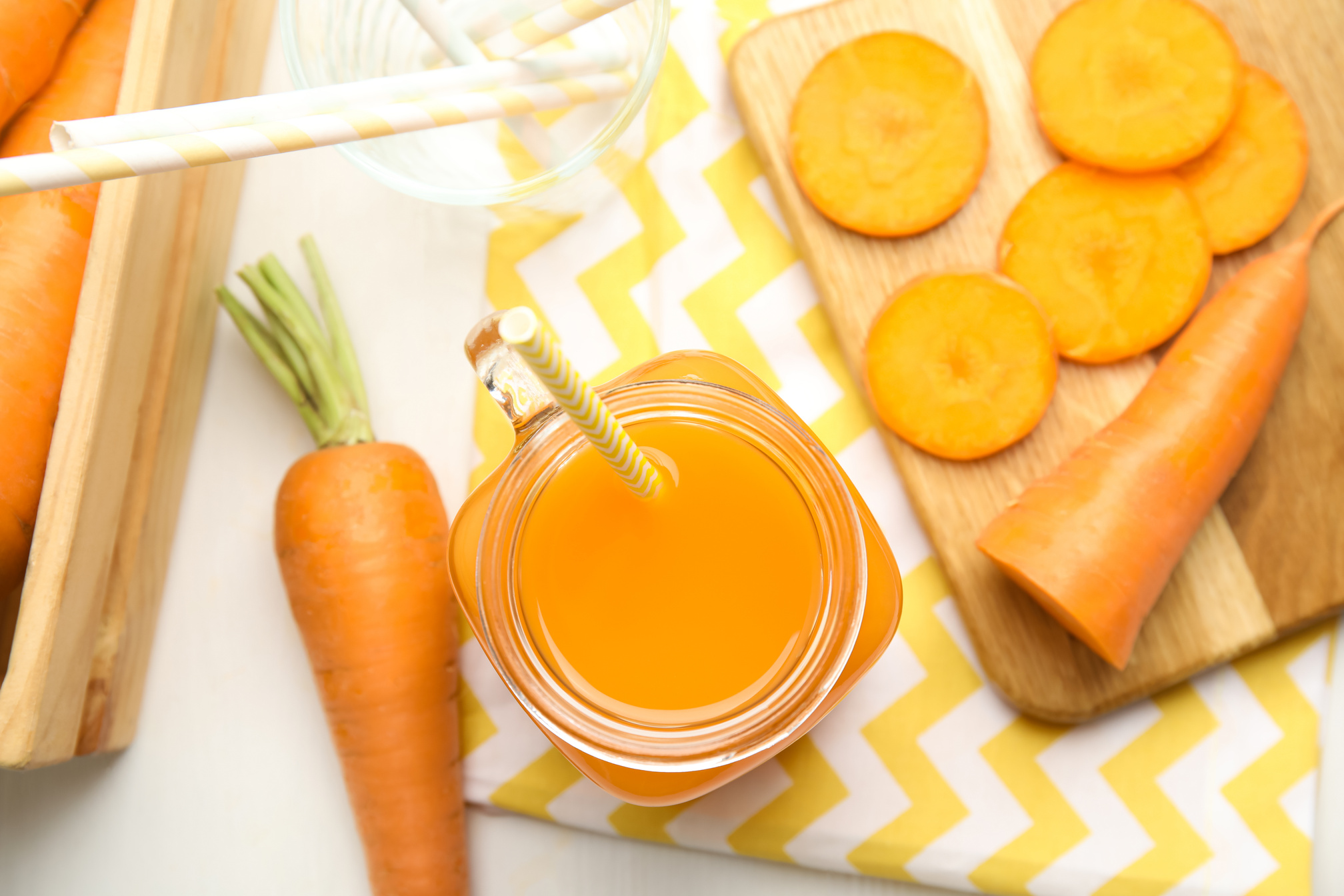 Freshly Made Carrot Juice in Mason Jar on White Table